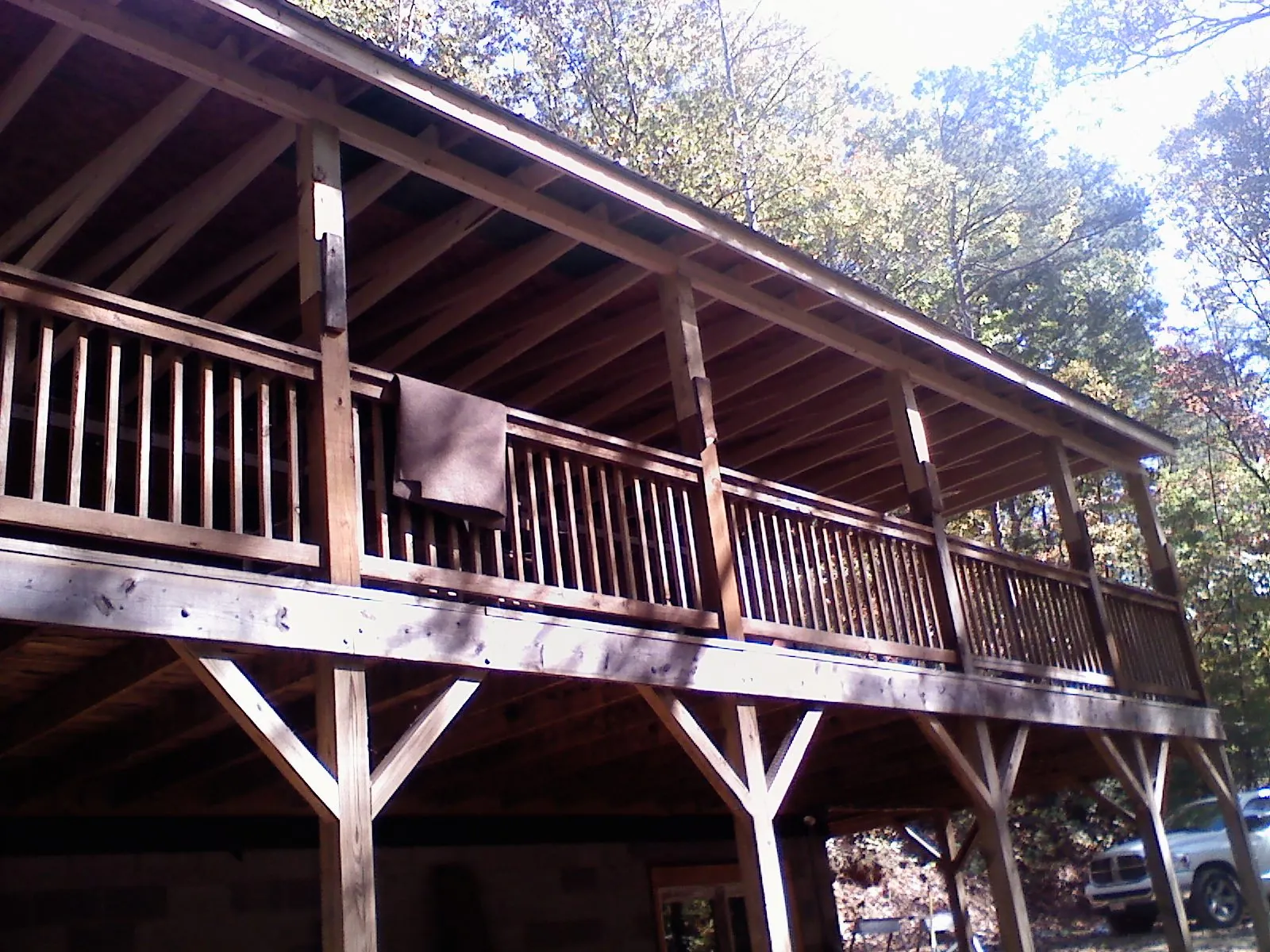 Timber framing under a new elevated porch and deck — Roof Leak Repair in Silsbee by Roofing Brothers